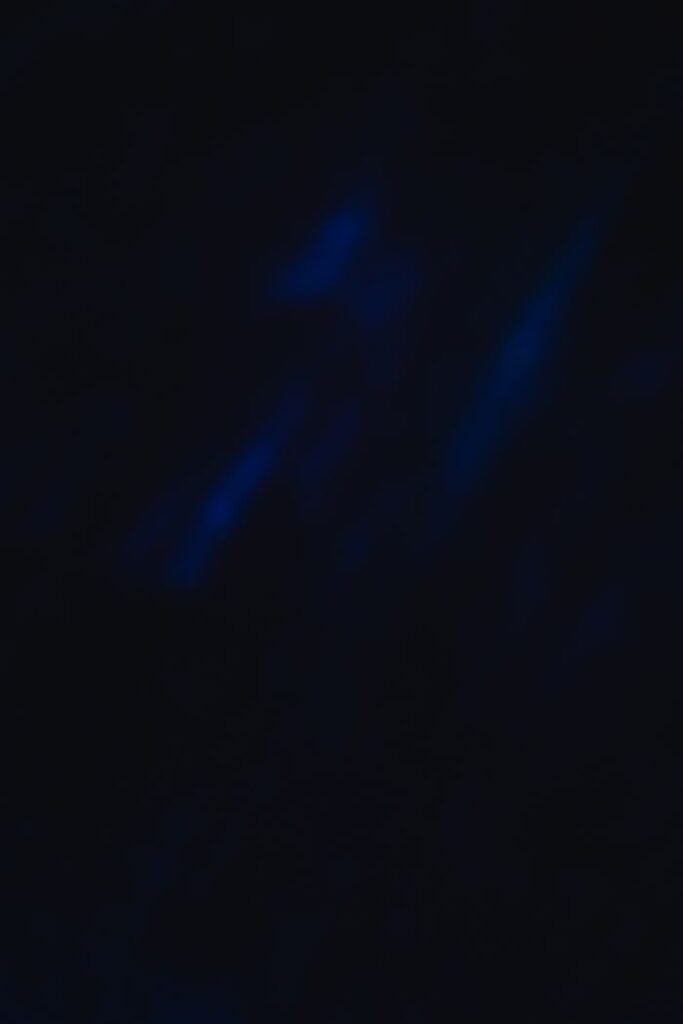 An abstract dark blue textured background with blurred elements, perfect for design projects.